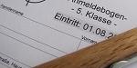 Foto des Anmeldebogens mit Kugelschreiber