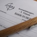 Foto des Anmeldebogens mit Kugelschreiber